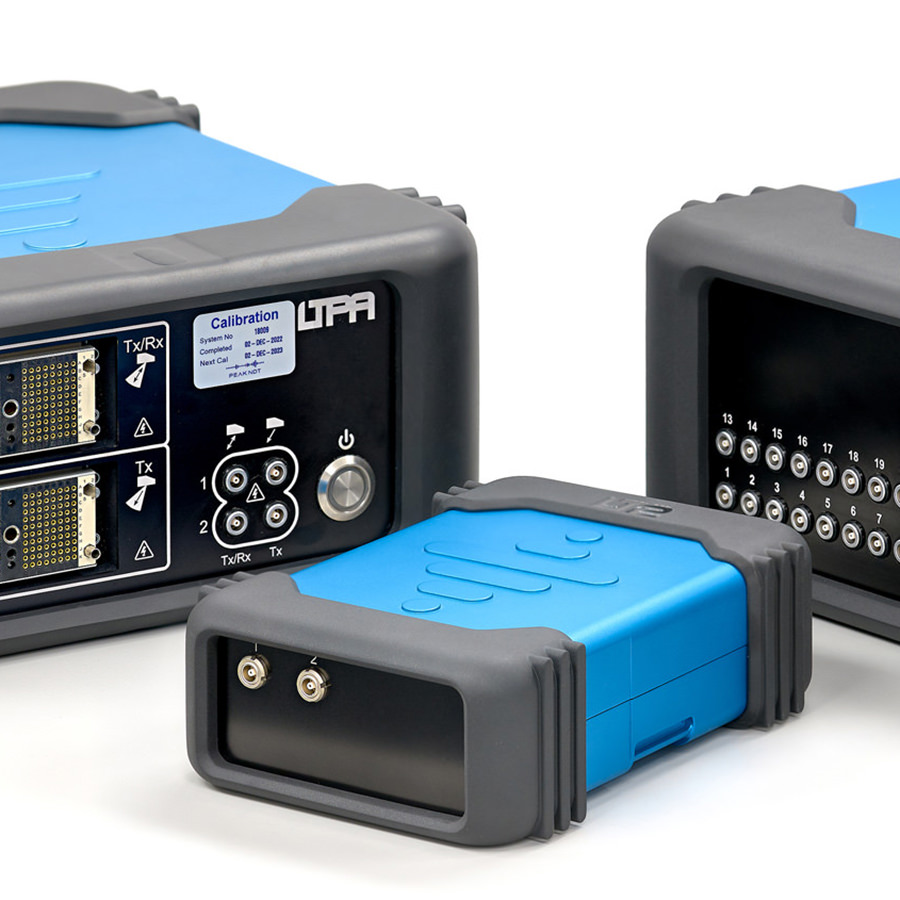 Blue and grey electronic test equipment modules on a white background, showing front panels and connectors