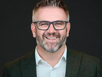 Professional headshot of senior leader — ProHeadshots UK
